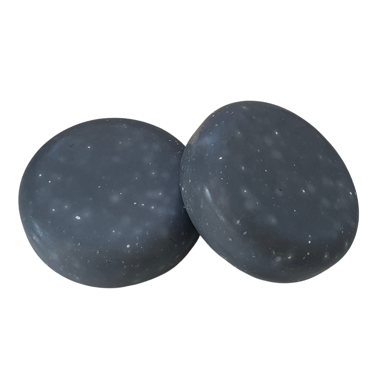 Image shows two bars of Evee Ivy Oh's Almond Milk and Activated Charcoal soap.  Our milk bars are round and flat pebble-like. This image shows that they have rounded sides.