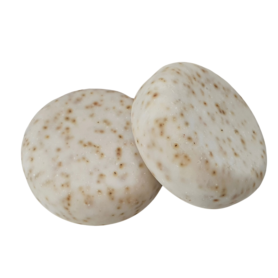 An image showing two of Evee Ivy Oh Goat Milk and Tea Tree Soaps. Milky white body with olive green speckles.